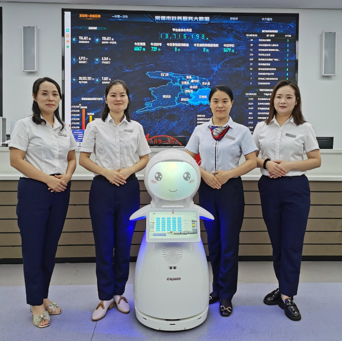 Robot de servicio Snow AI en el Centro de Servicios Administrativos del condado de Changde Hanshou, liderando la nueva tendencia de la ciencia y la tecnología en el futuro.